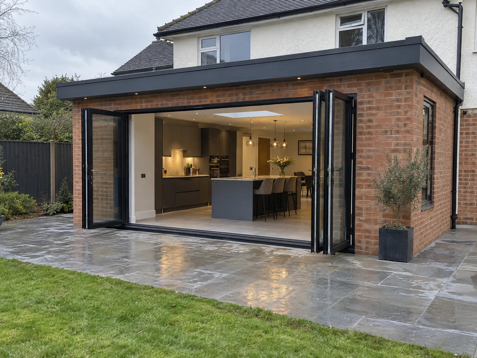 Modern brick-built single storey rear extension with bi-fold doors opening to kitchen and dining area