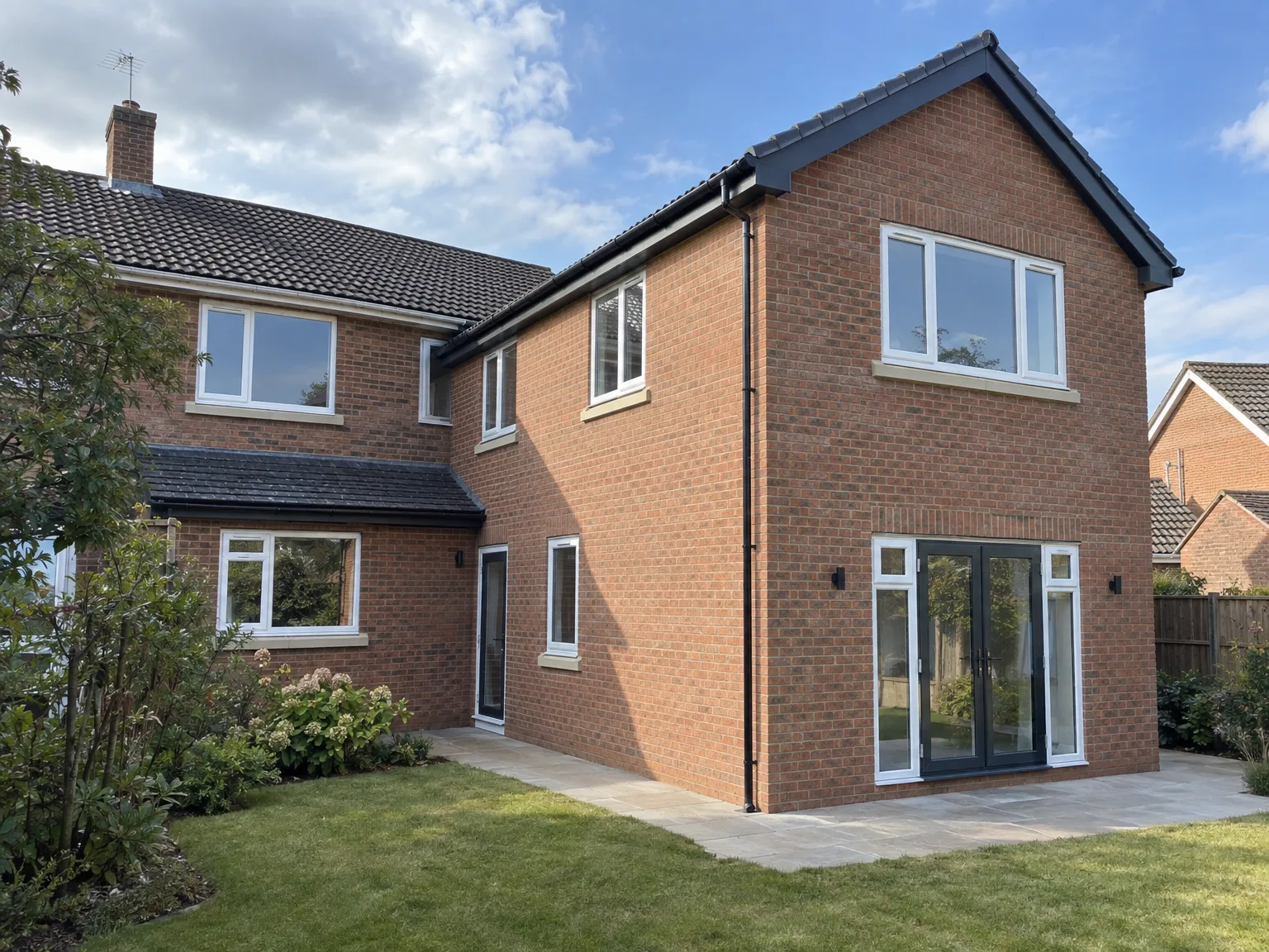 Rear Extension with modern brick finish, bifold doors and new patio
